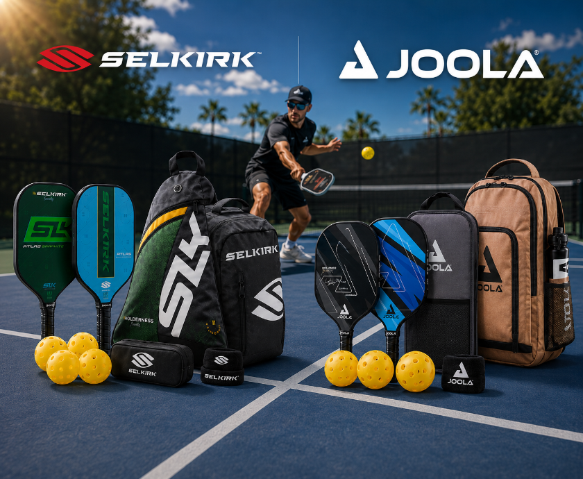 A promotional outdoor scene on a pickleball court showing multiple Selkirk and Joola paddle sets with bags and balls, plus a player in action in the background. The Selkirk logo appears at top left and the Joola logo at top right.