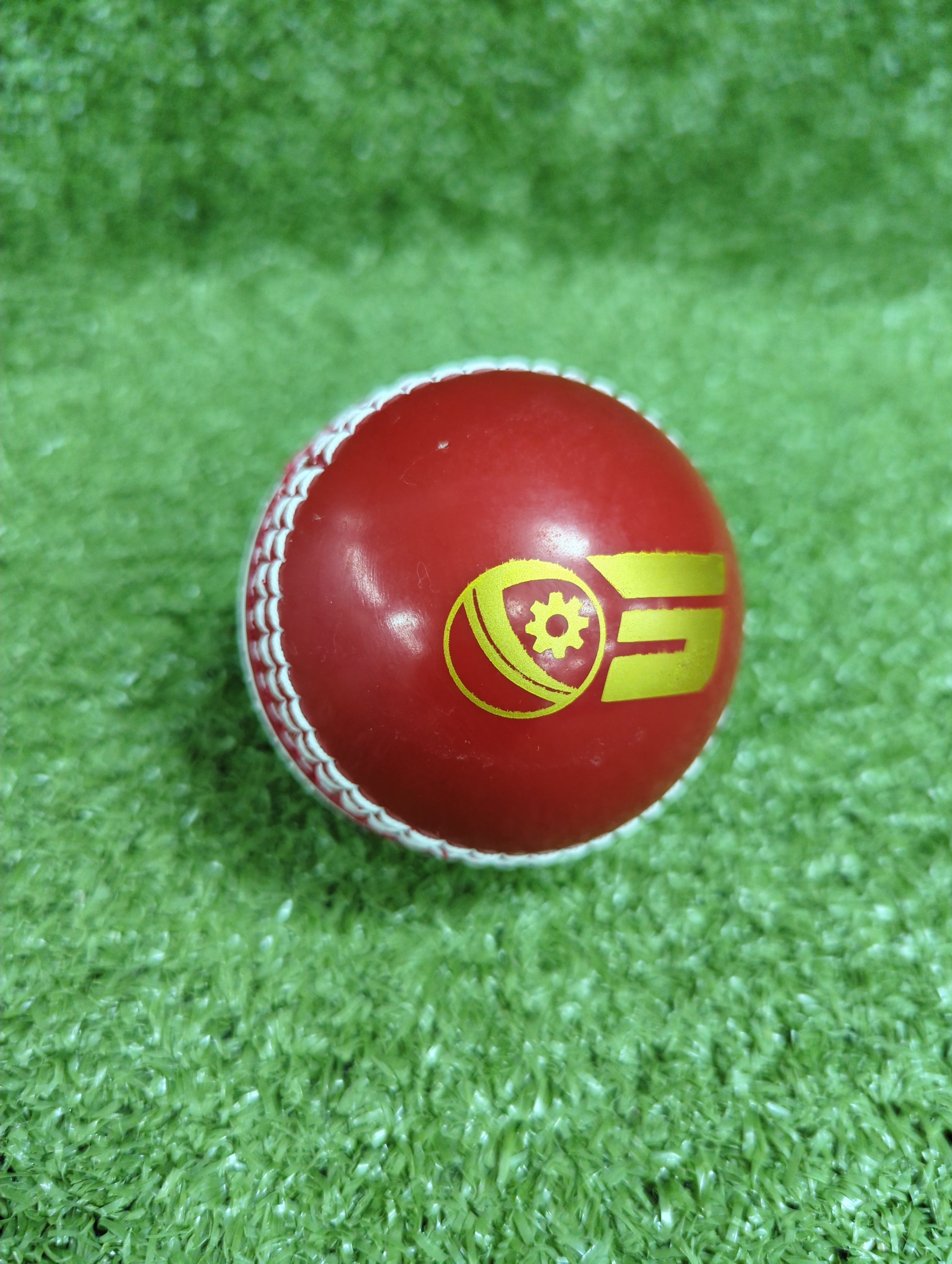 Raydn Incredible PU Red and White Synthetic Cricket Ball - 110 Grams - Front