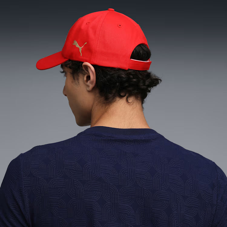 Side profile view of the red Royal Challengers Bangalore IPL cap highlighting the curved brim and structured 6-panel design.