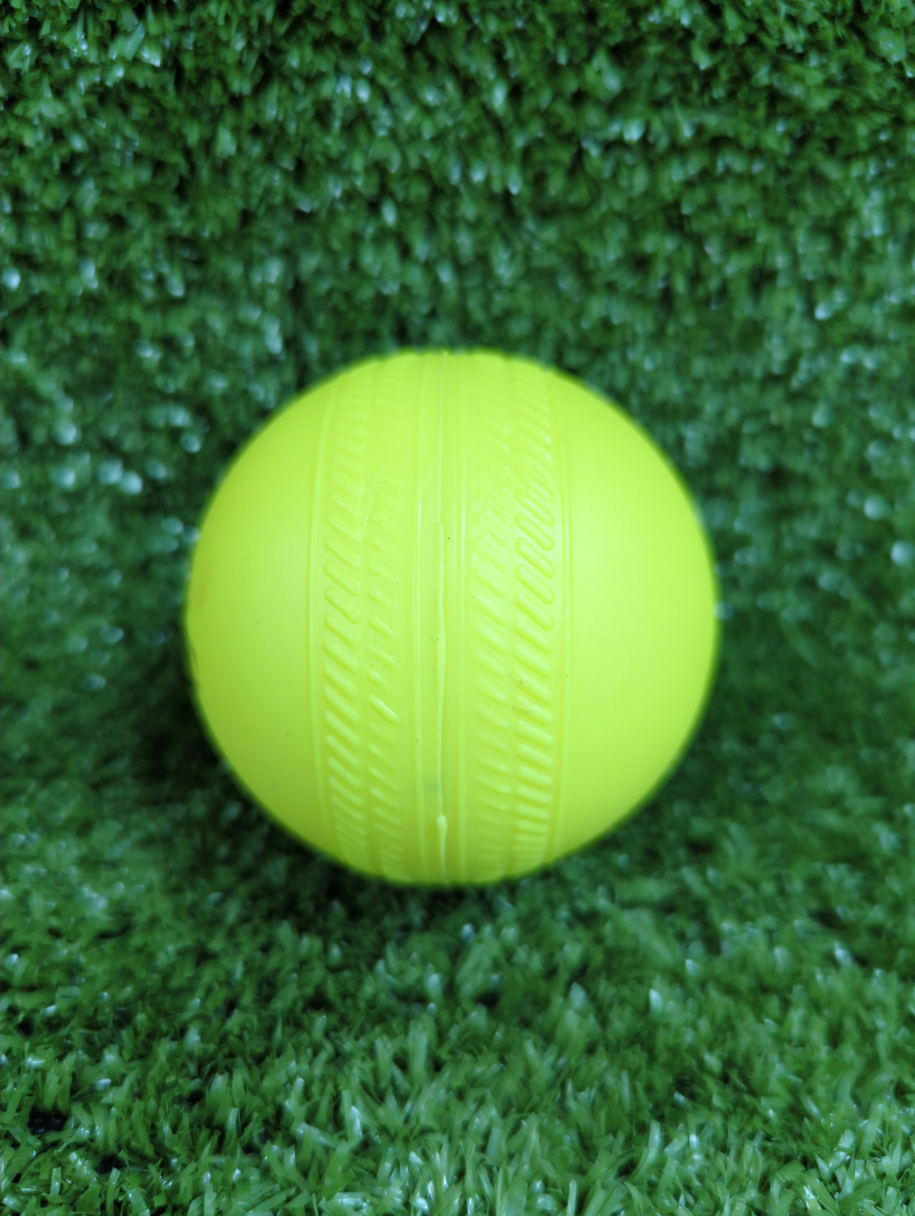 Gravity Hard Plastic Cricket Ball by Gravity - close-up detail - TopCricketStore