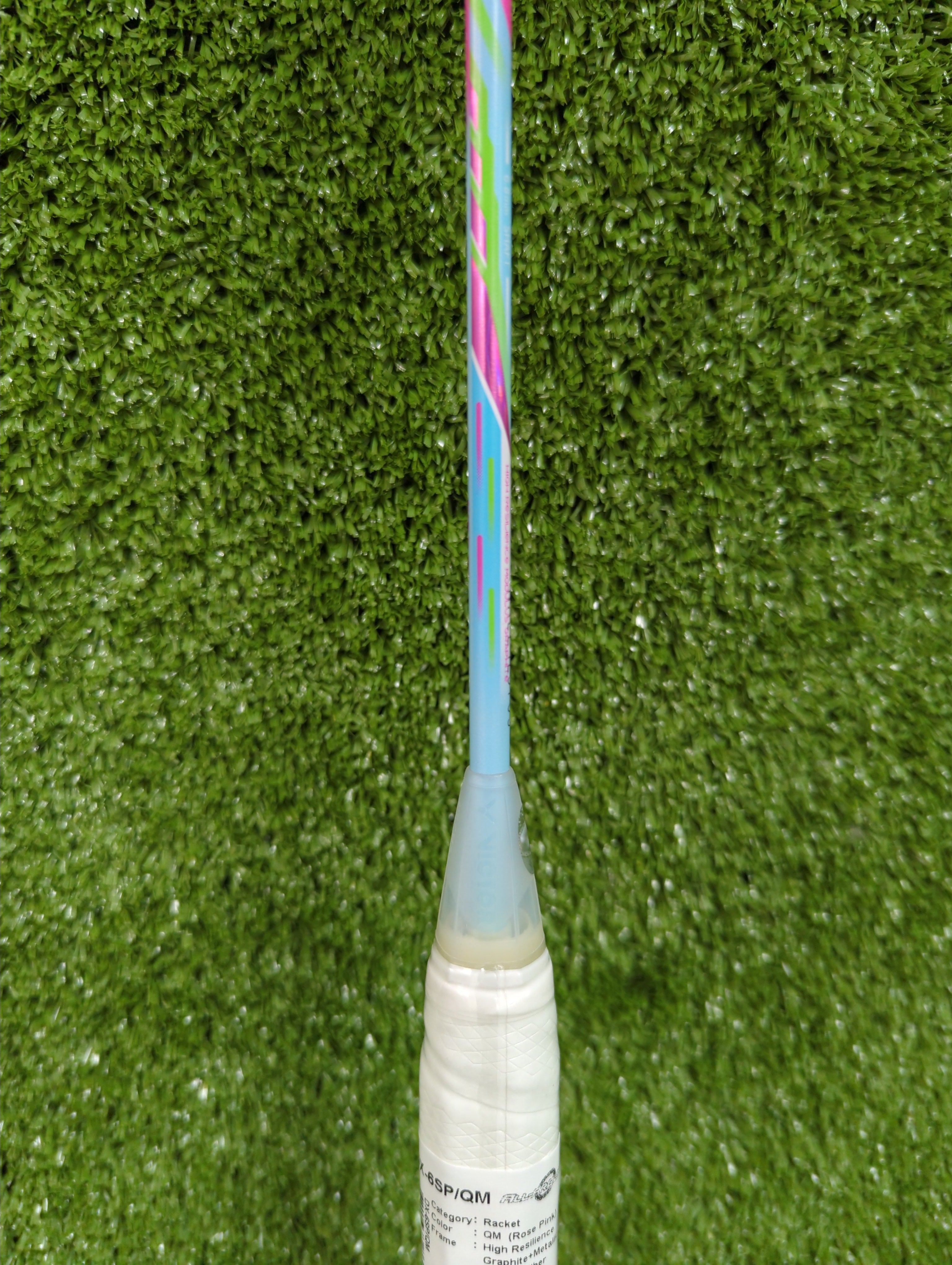 Detail of the T-joint and shaft transition on the Victor DriveX 6SP QM pink and teal racket.