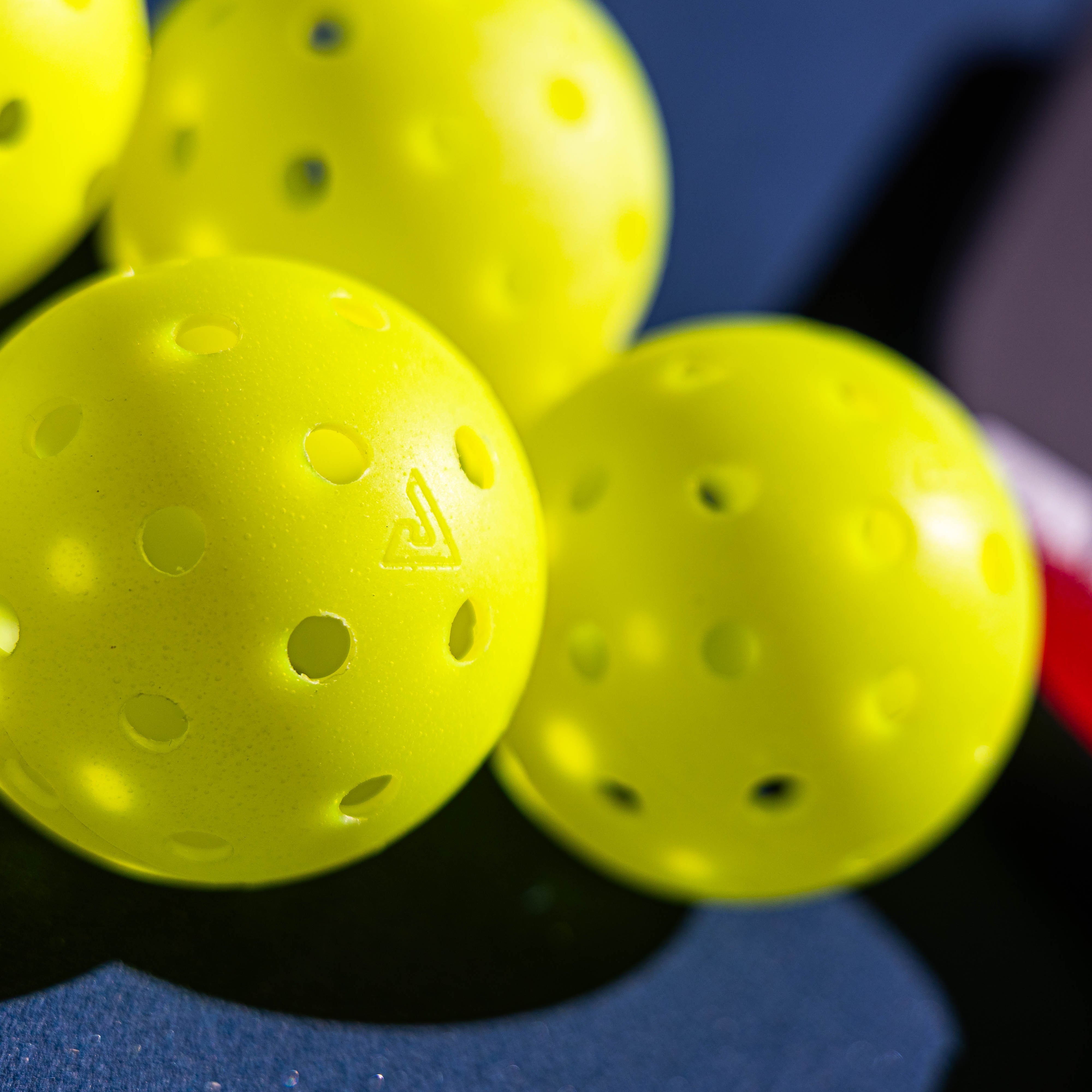 JOOLA HC-40 pickleballs showing 40 equidistant holes