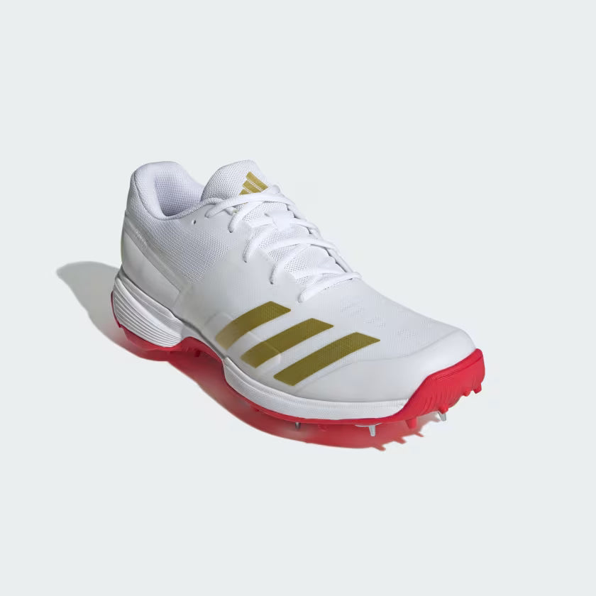 Adidas 22YDS Cloud White / Gold Metallic / Pure Ruby Cricket Metal Spike Shoes by Adidas - close-up detail - TopCricketStore