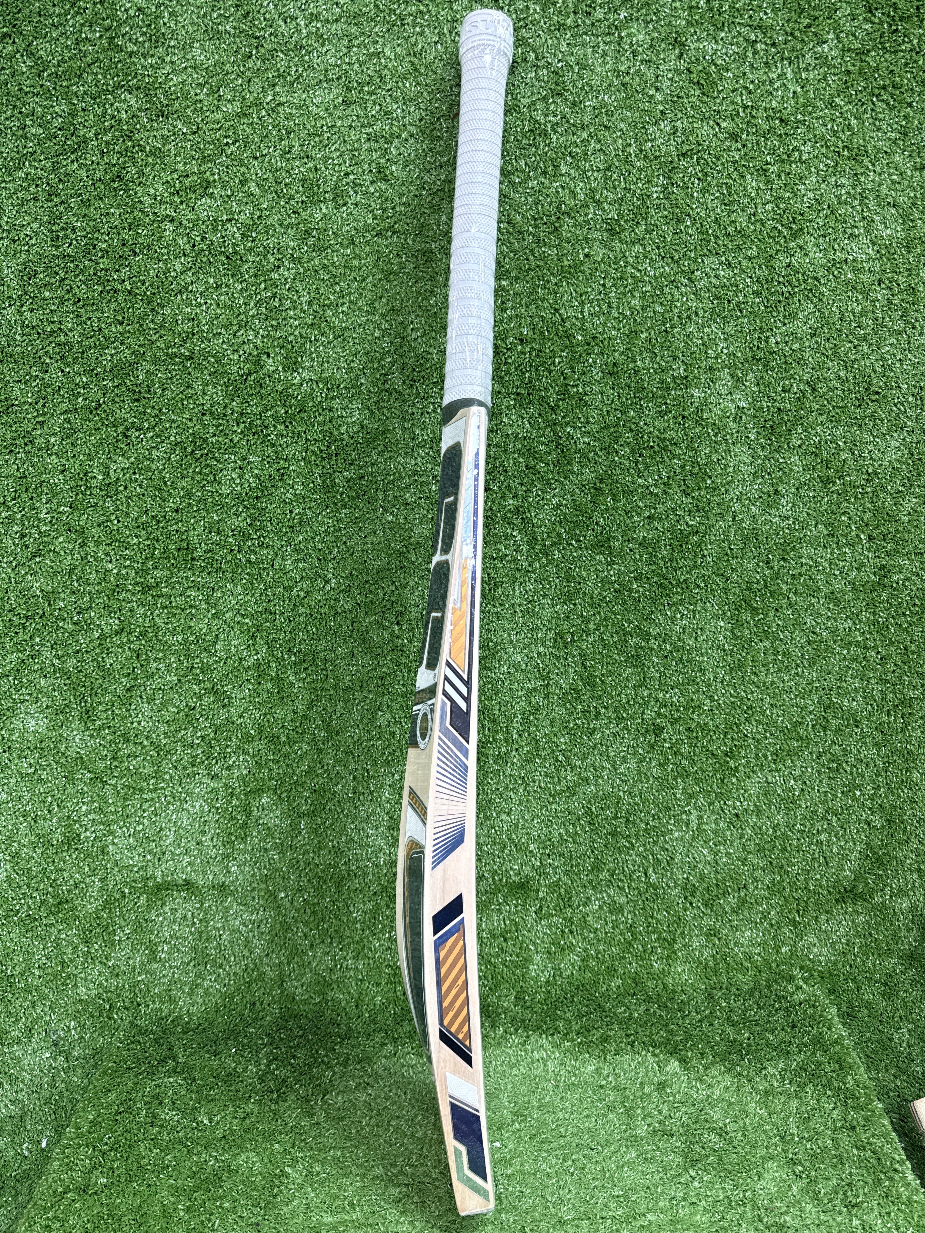 Side profile of SS Master 99 cricket bat showing massive concave TON edges