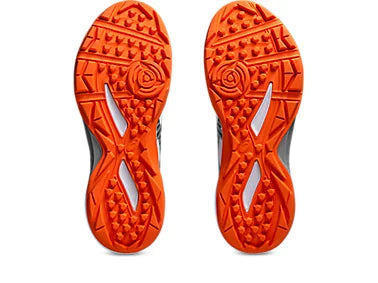 Close up side view showing the wrap-up outsole designed for lateral support on cricket pitches.