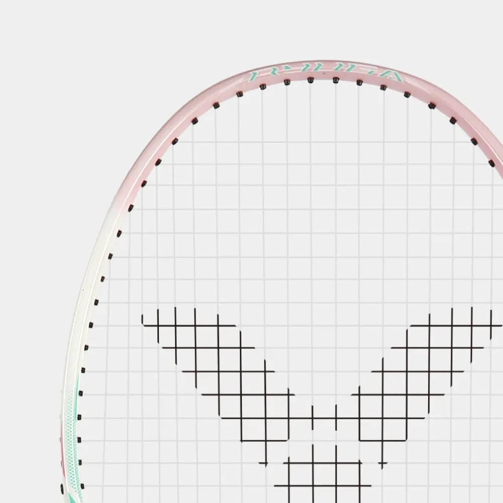 Top view of the Victor Thruster Ryuga Sport I racket head with pink frame and white accents.