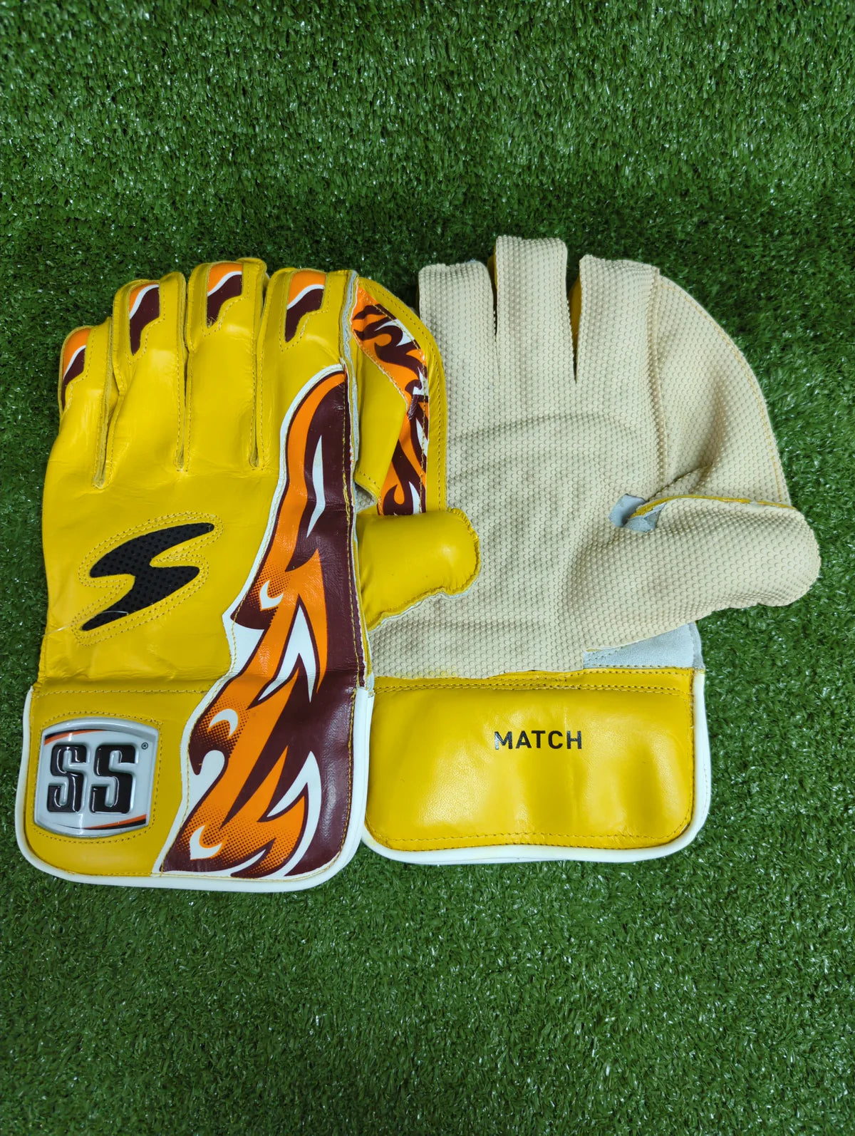 Full front view of the yellow SS Match Junior Wicket Keeping Gloves showing the rubber palm grip.