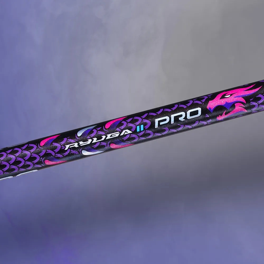 Detailed view of the aerodynamic T-joint on the Victor Thruster Ryuga II Pro B, highlighting the sleek Mazarine Blue paint finish and carbon fiber construction.