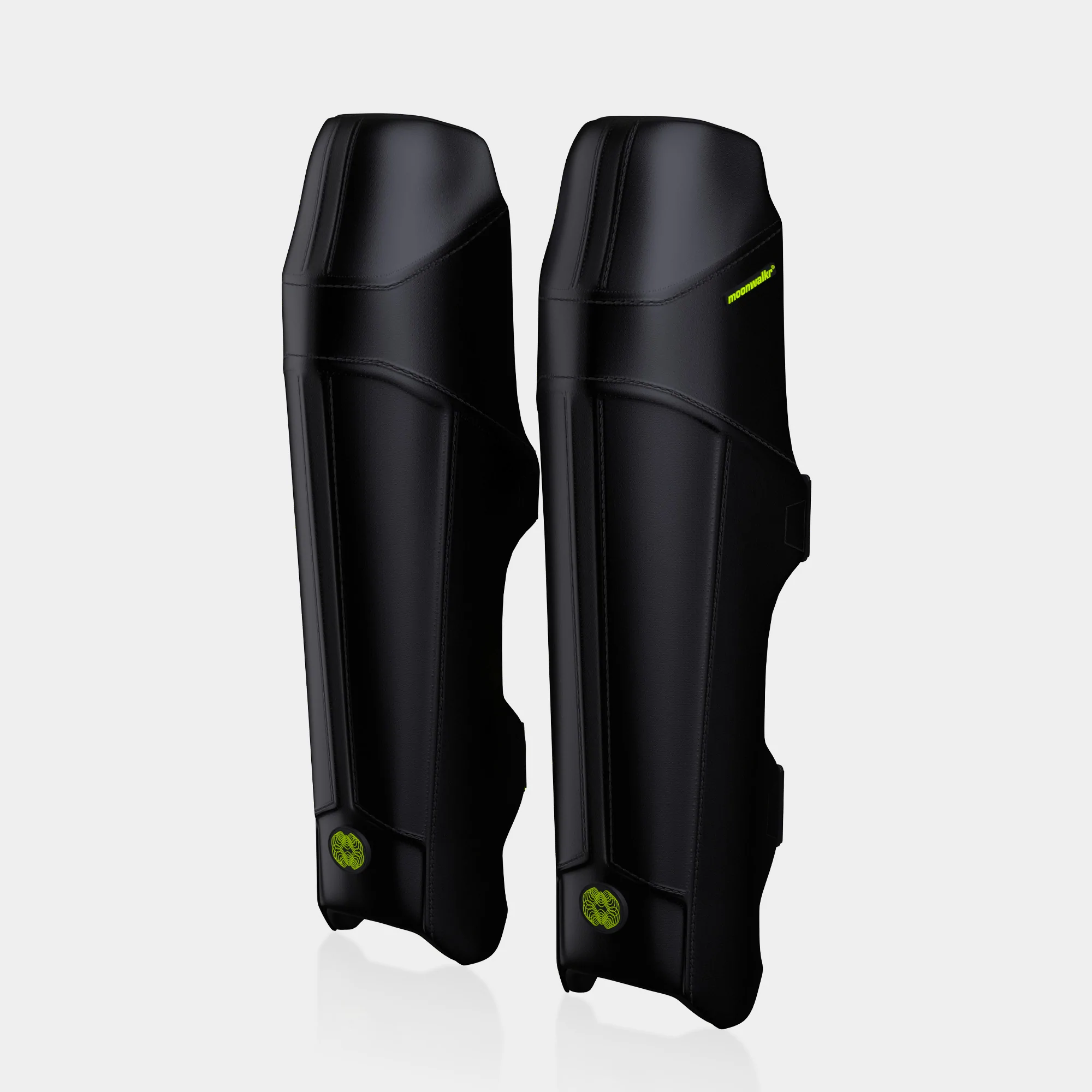 Front view of black MoonWalkr 2.0 leg guards showing the streamlined design for modern cricketers.